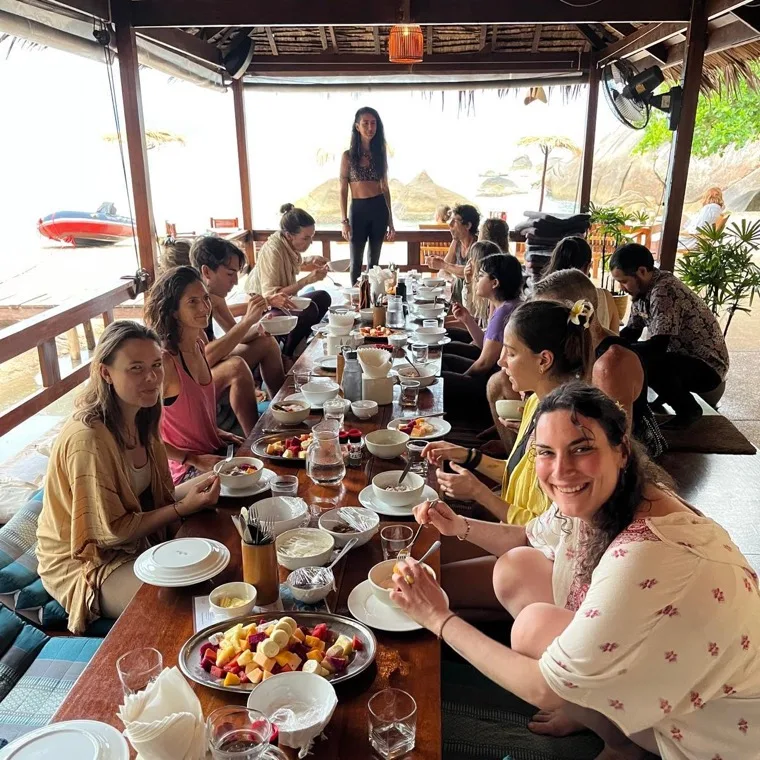 The group sharing breakfast at the beachfront restaurant